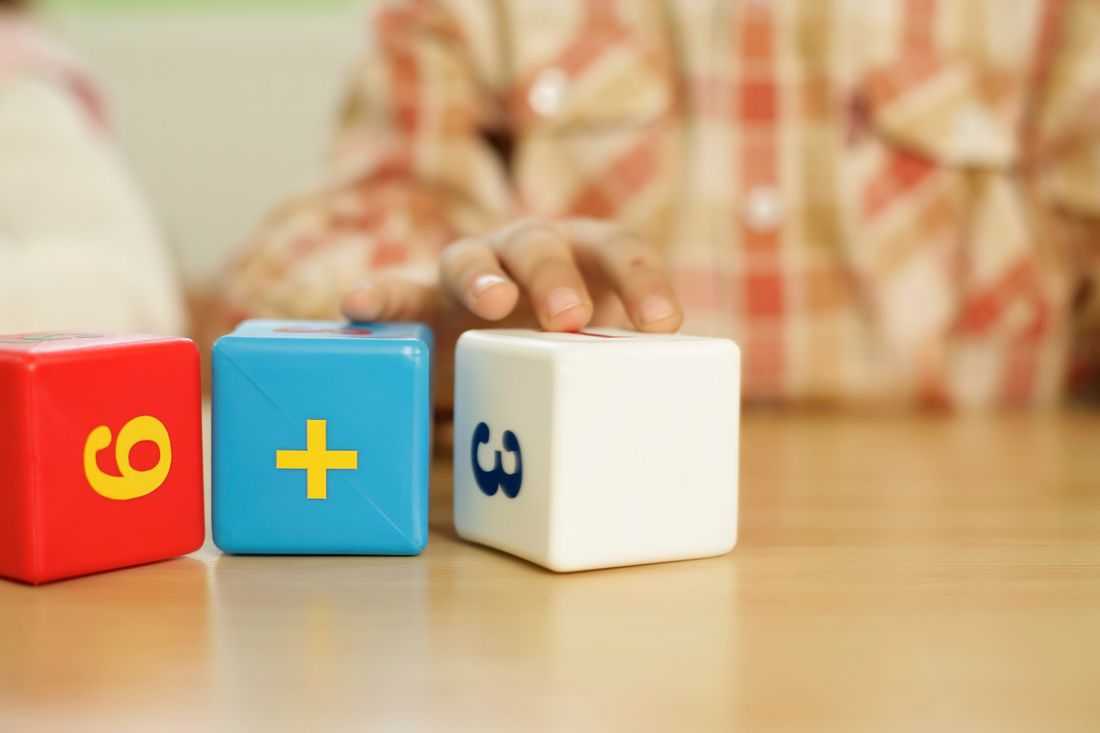 Colorful number blocks showing a simple addition problem