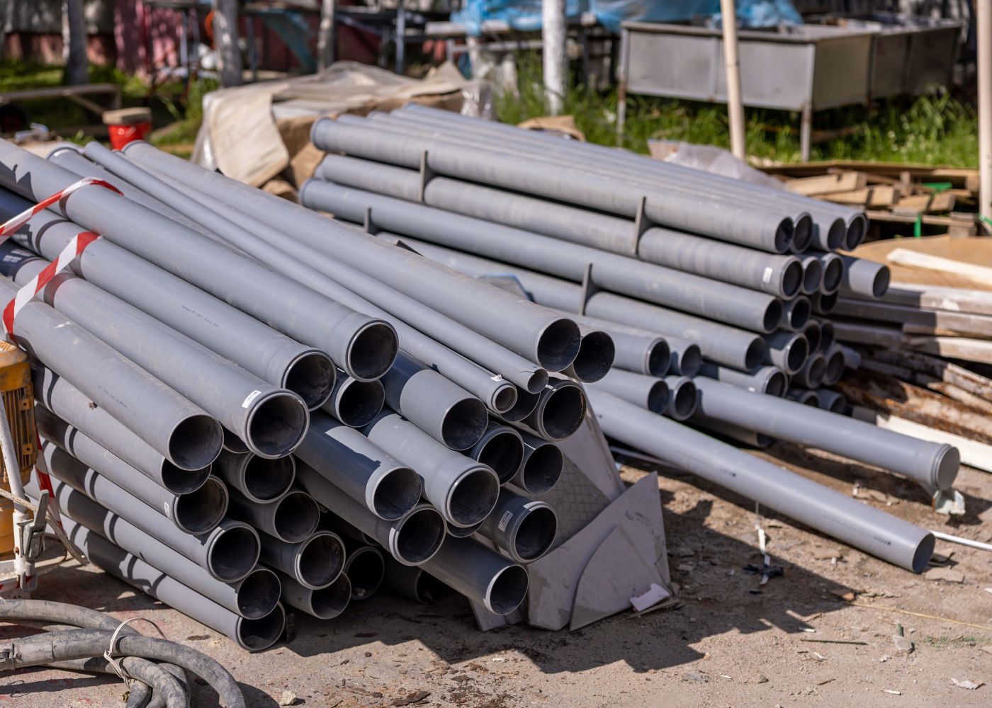 Stacked steel fence pipe ready for pickup