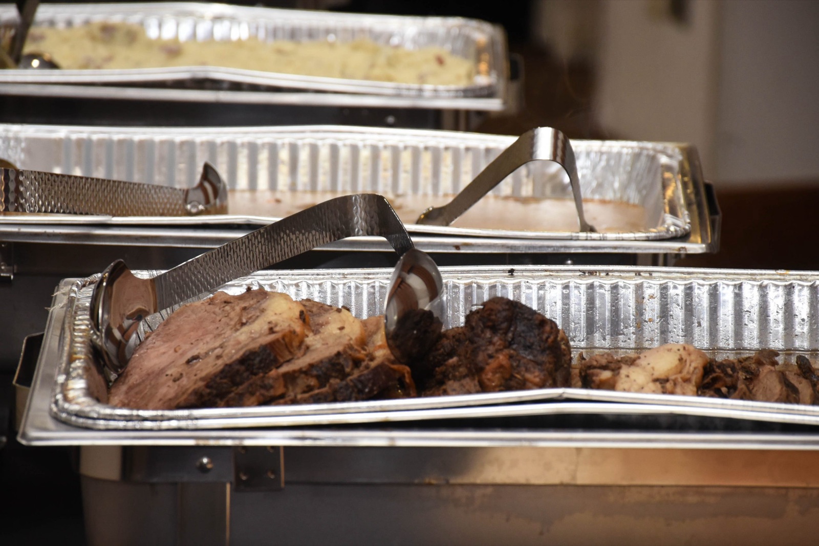 Sliced smoked brisket in the serving tray