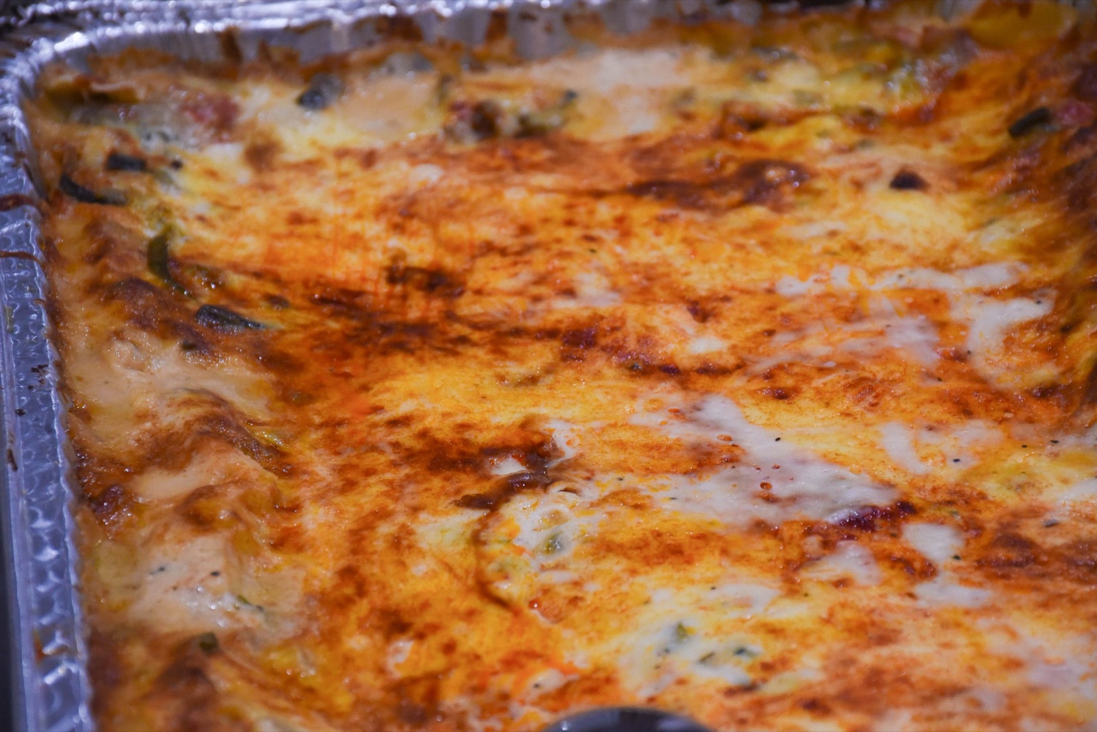 A tray of scratch baked cheesy casserole