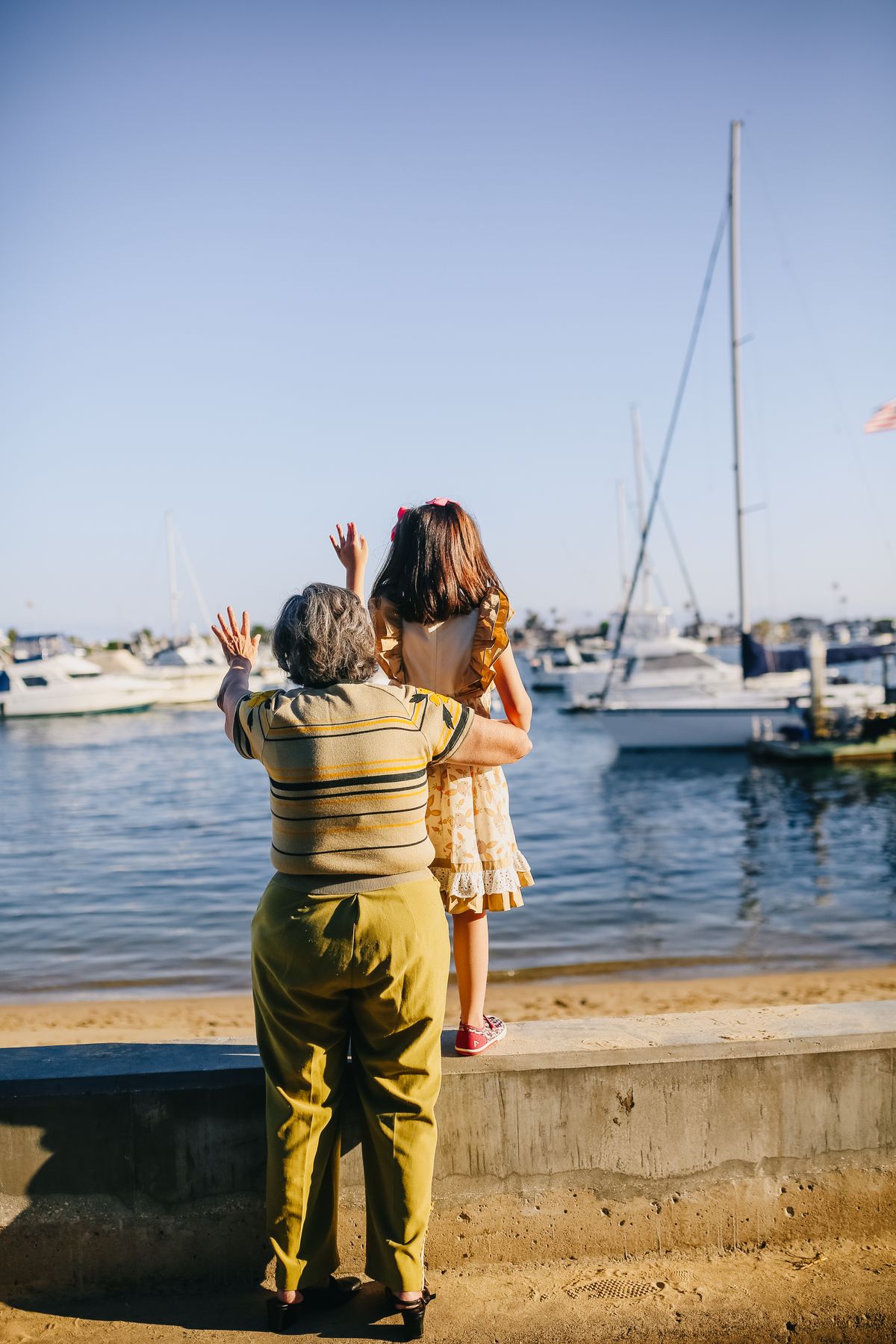 A grandmother and grandchild by the waterfront